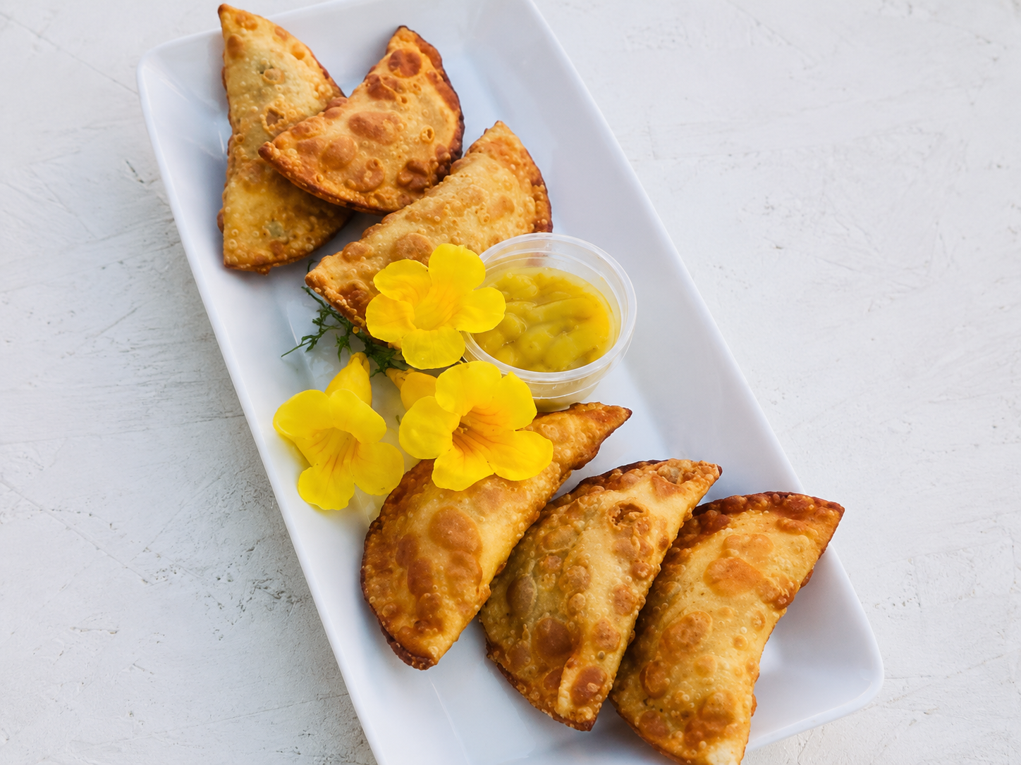 Porção de pastéis